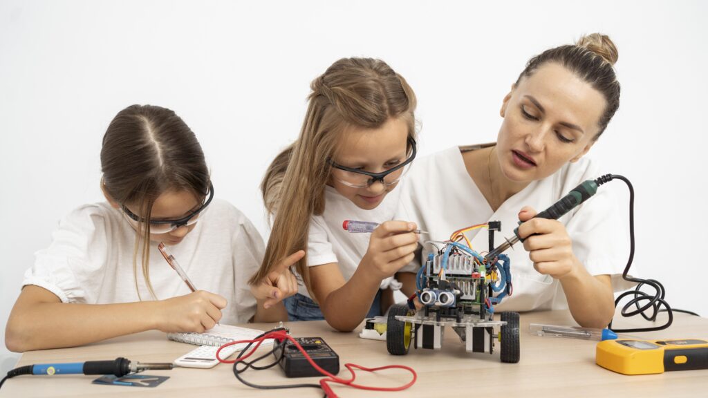 smarter toys girls female teacher doing science experiments together with robotic car